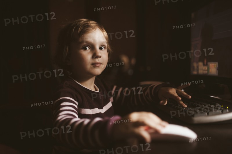 Caucasian boy using computer