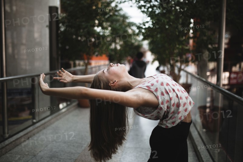 Caucasian woman dancing outdoors