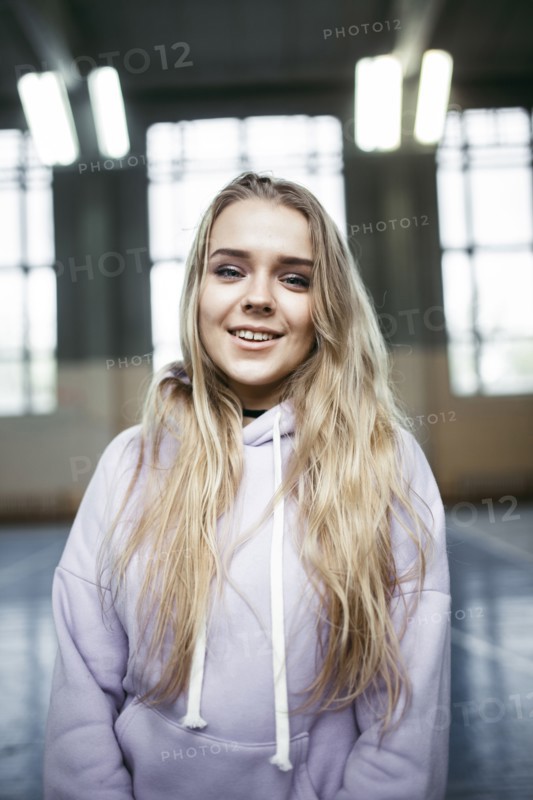 Portrait of smiling Caucasian woman wearing hoodie