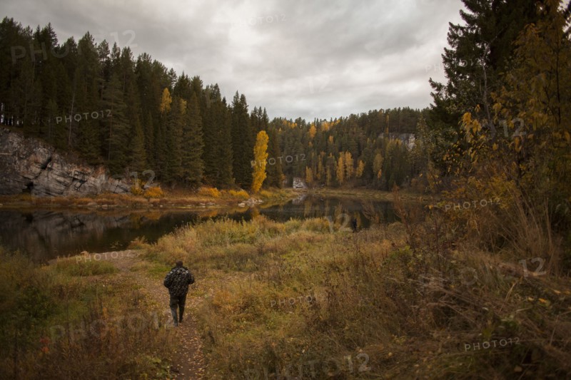 Caucasian man walking in rural landscape