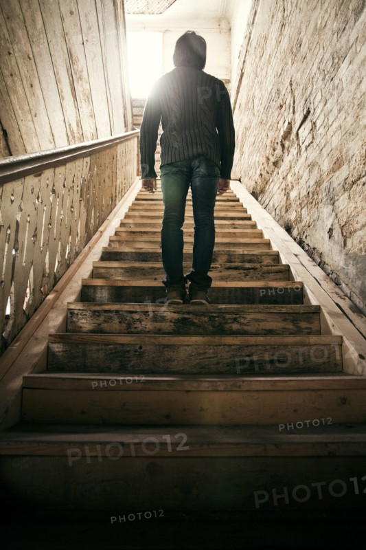 Mari man standing on staircase