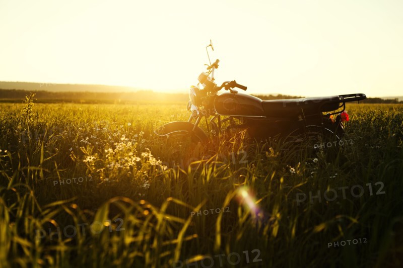 Motorcycle parked in rural field