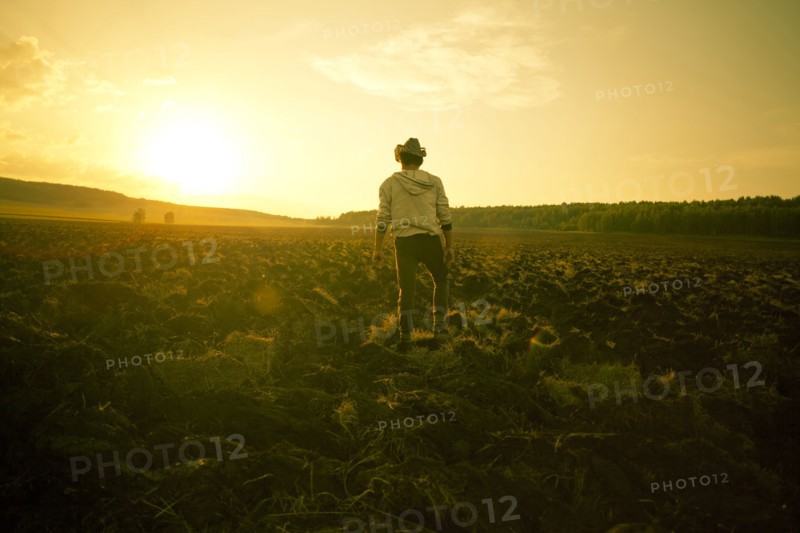 Mari man standing in rural field