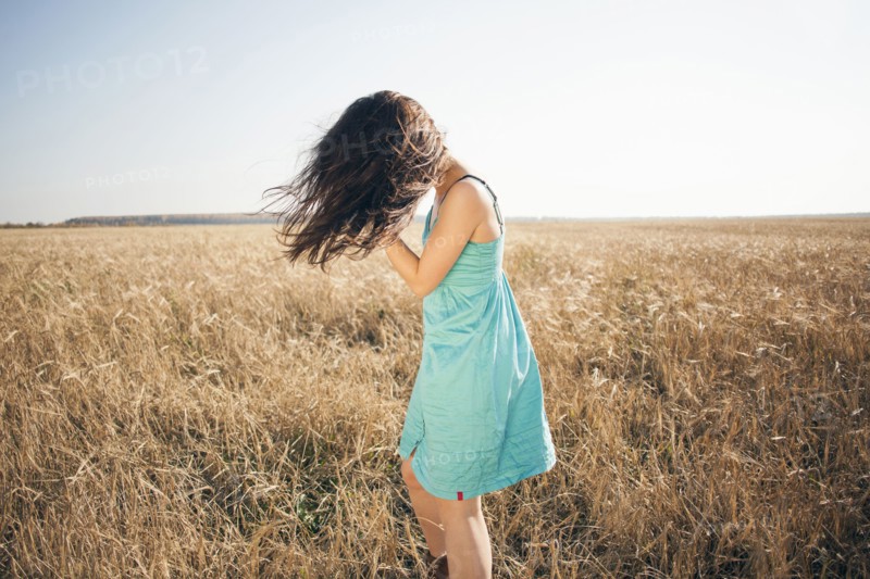 Caucasian woman standing in rural field