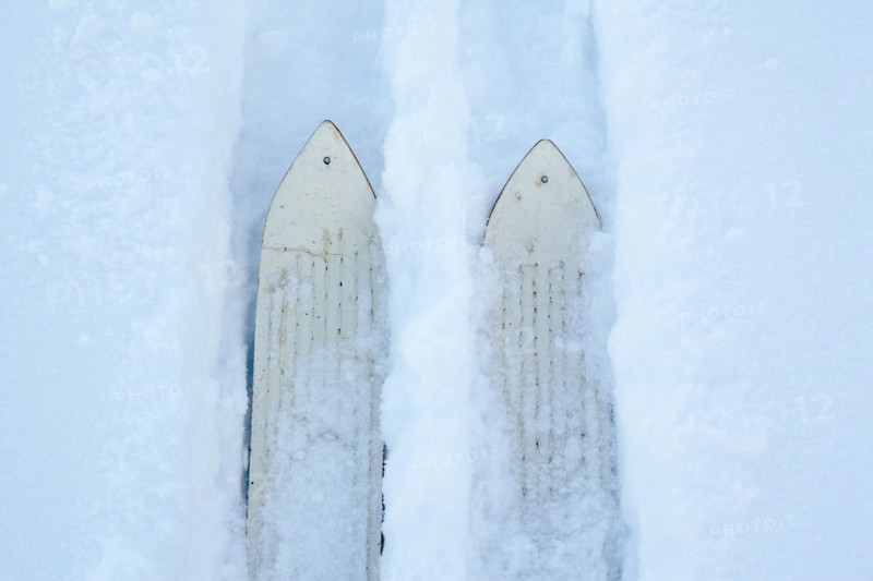 High angle view of skis making tracks in snow