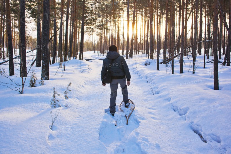 Mari man snowshoeing on snowy path