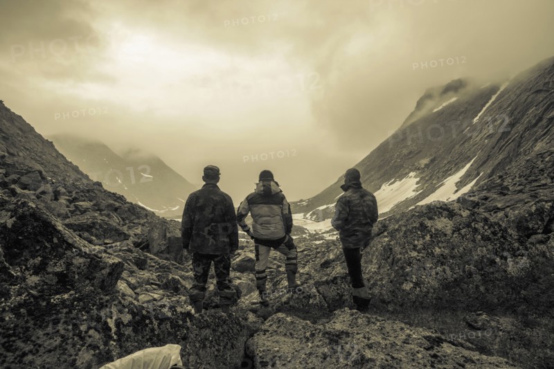 Hikers admiring mountain valley