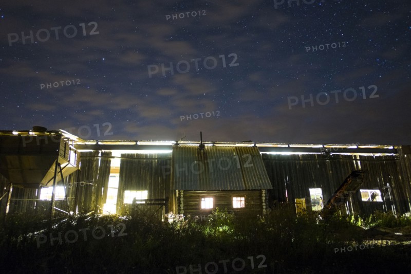 Illuminated cabin under morning sky