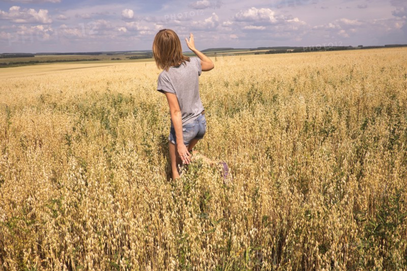 Caucasian woman walking in field