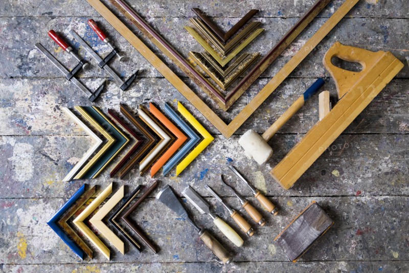Picture frame tools on splattered table