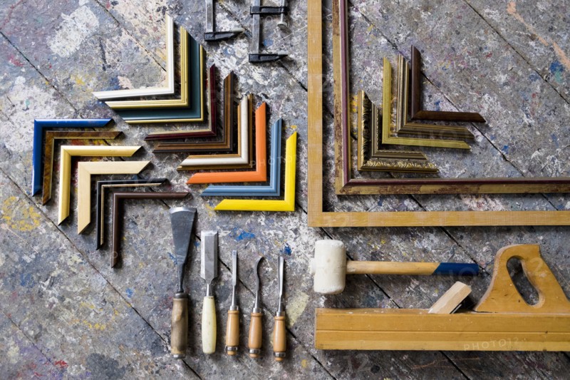 Picture frame tools on splattered table