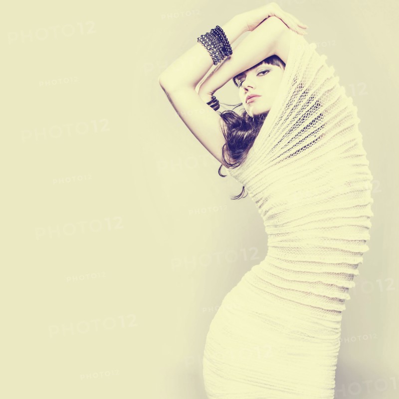 Serious Caucasian woman wearing ribbed dress