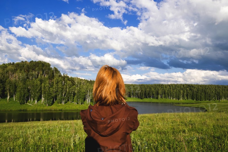 Woman admiring scenic view of river