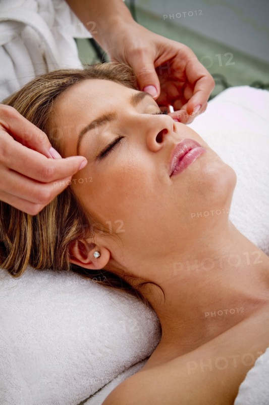 Hispanic woman having facial