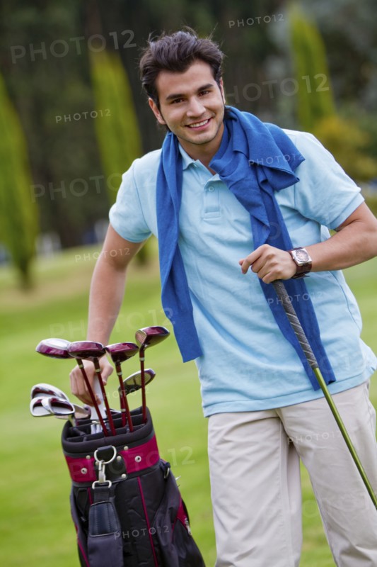 Hispanic man playing golf