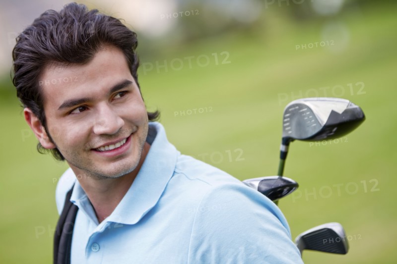 Hispanic man playing golf
