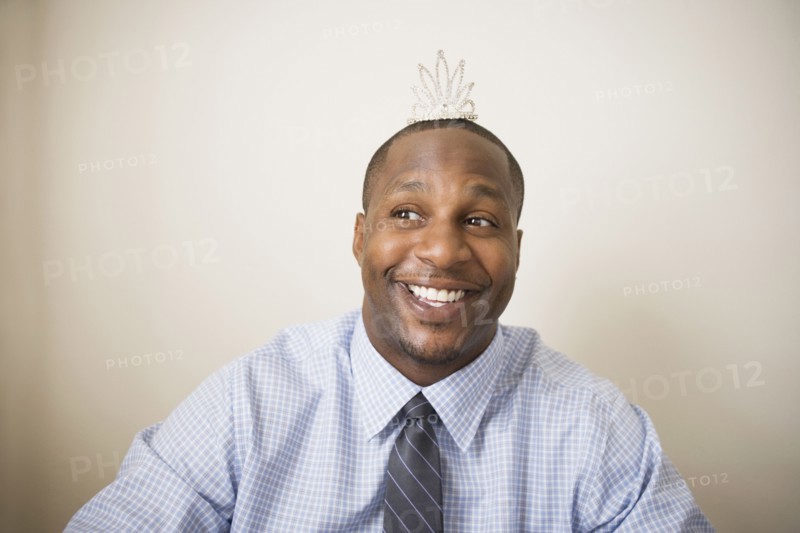 African man wearing tiara