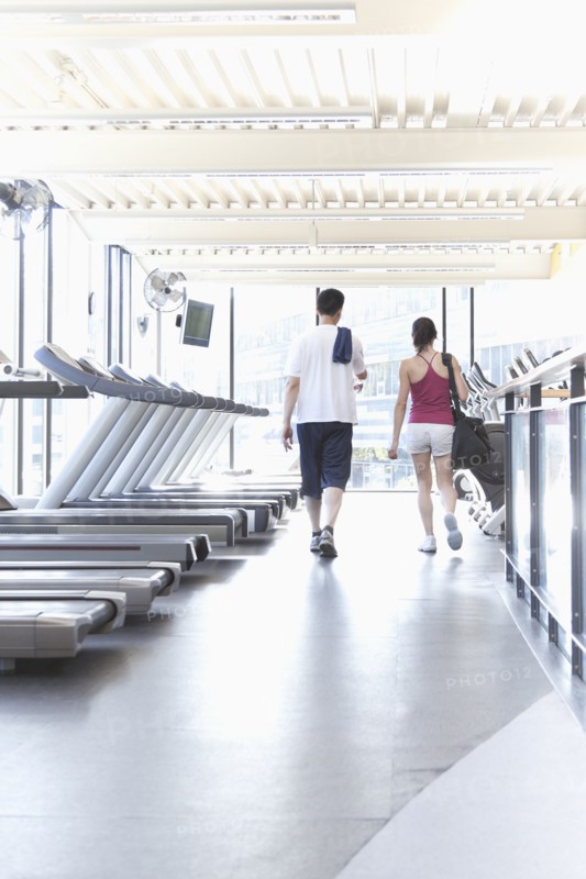 Couple walking together in health club