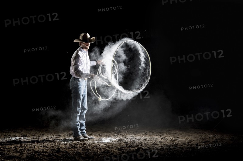 Caucasian cowboy spinning lasso