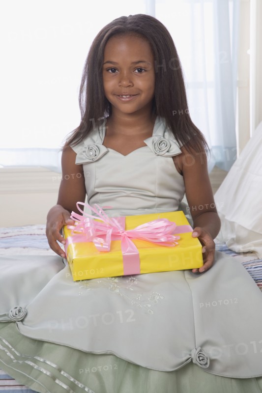 African American girl holding gift
