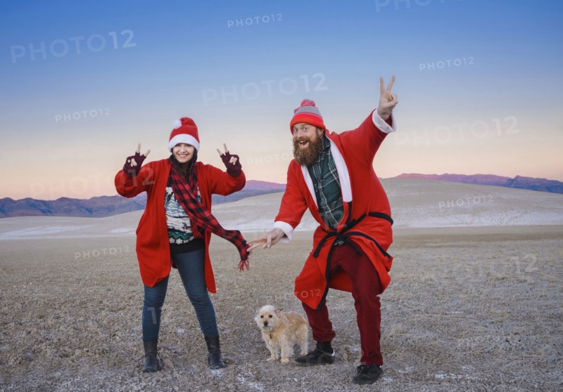 Festive couple celebrating Christmas in the desert