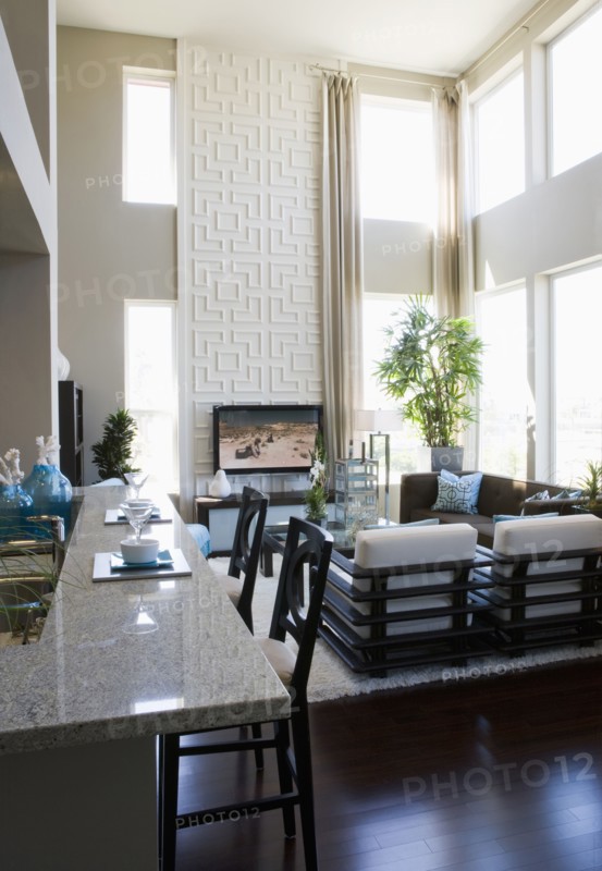 Contemporary loft interior with breakfast bar and living room