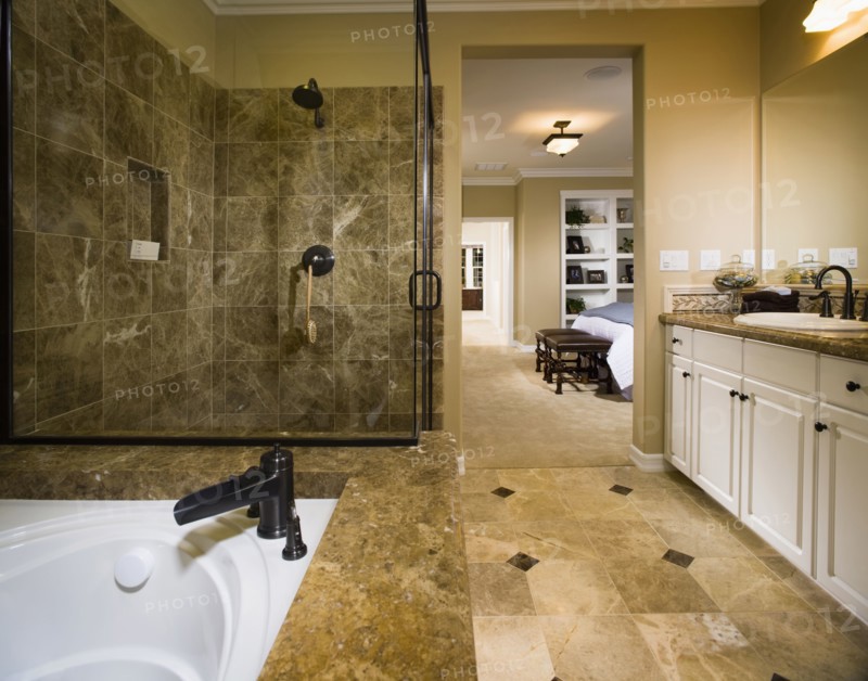 Master bathroom with large tub and glass shower