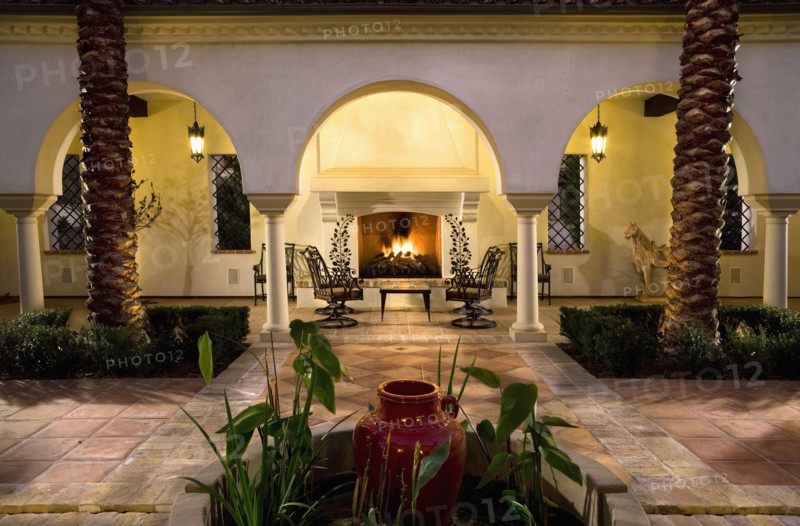 Sitting area with fireplace in courtyard