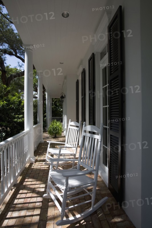 Wooden rocking chairs on front porch