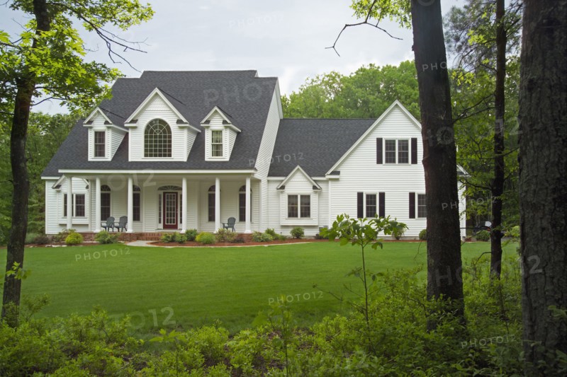 Exterior of a single family home with lawn in yard