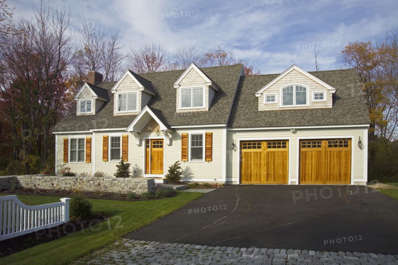 Driveway leading towards garage of single family home