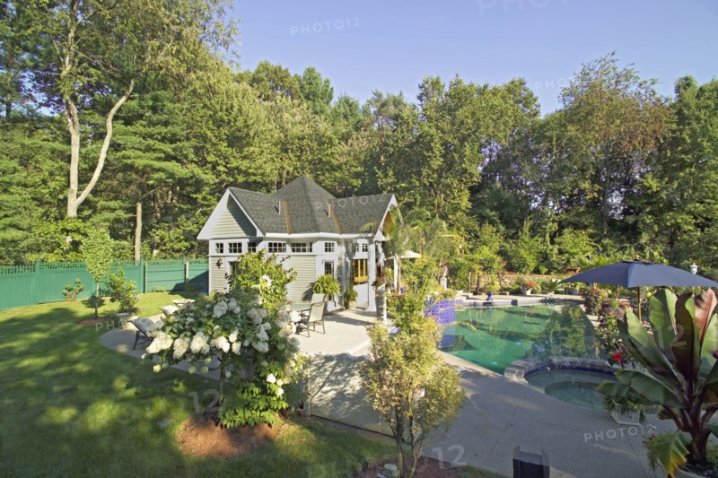 Swimming pool in front of pool house