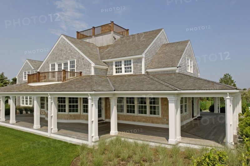 Exterior contemporary shingle style home with rooftop balcony