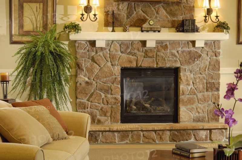 Close up of traditional living room with stone fireplace