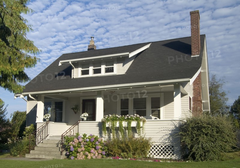 Exterior two story brown house with black roof at Bellingham