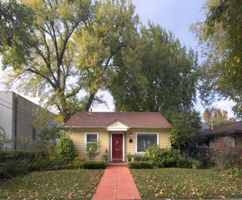 Front exterior yellow cottage