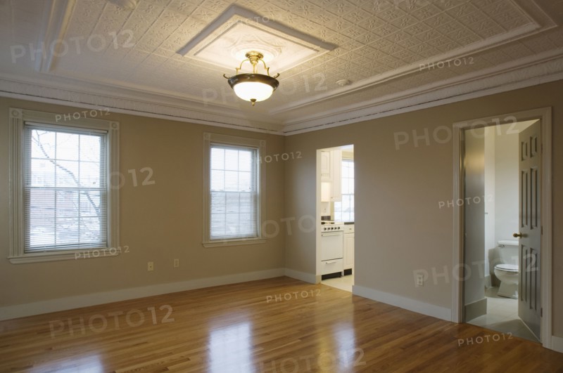 Empty room in apartment with hardwood floor