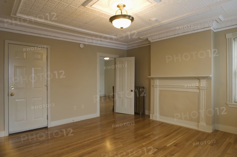 Room in empty apartment with hardwood floor