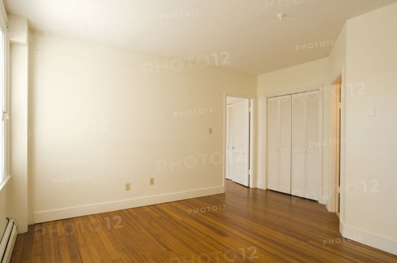 Empty room in apartment with hardwood floor