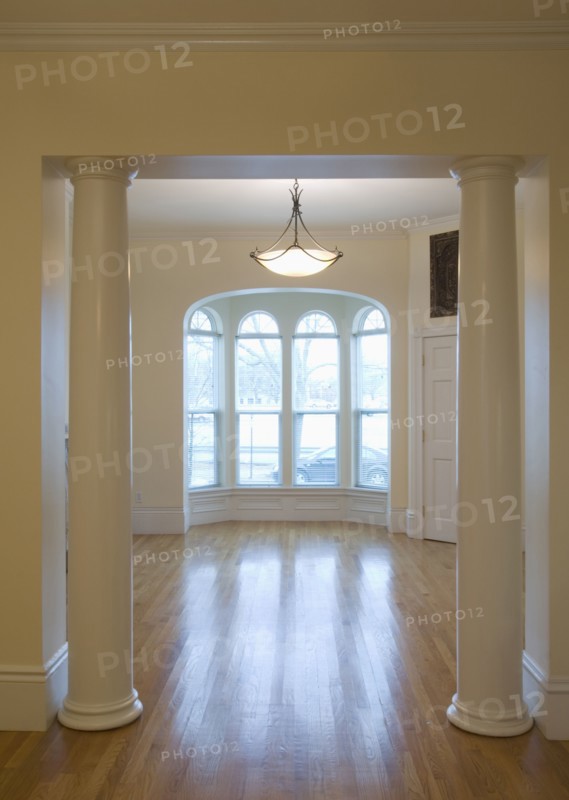 Empty room in apartment with hardwood floor and bay window