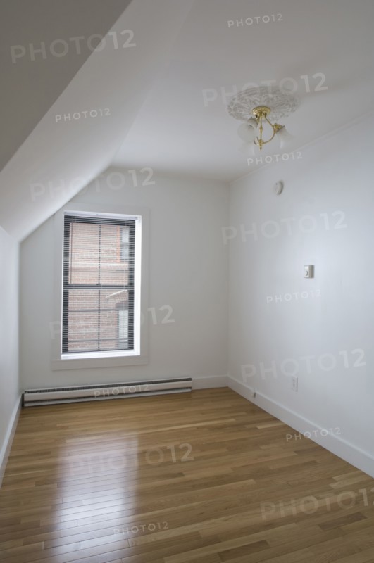 Empty room in apartment with hardwood floor