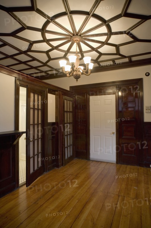 Empty room in apartment with hardwood floor