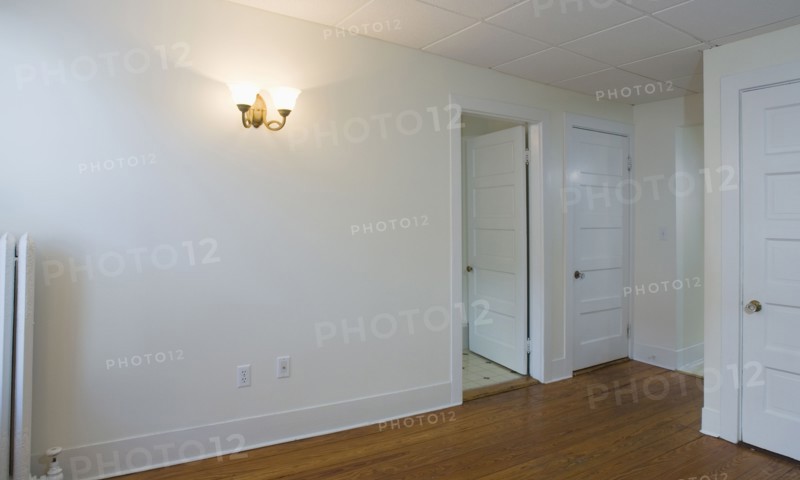 Empty room in apartment with hardwood floor