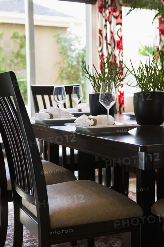 Place settings on traditional dining table