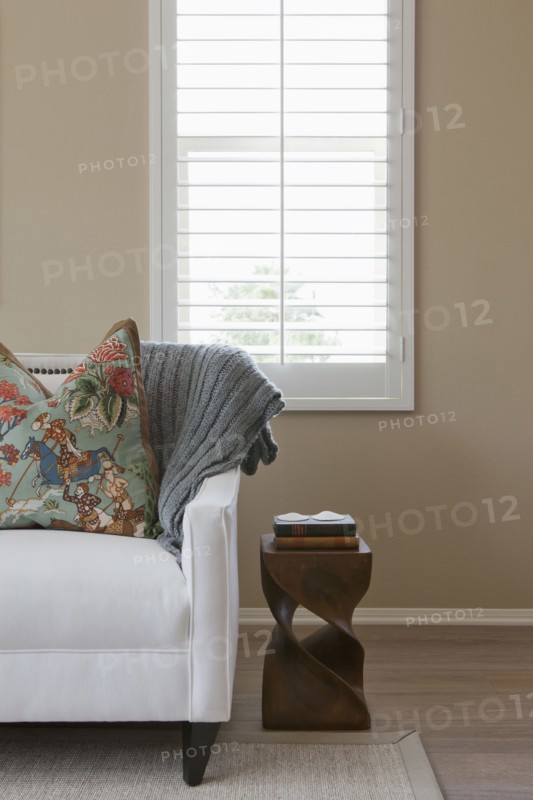 Cropped couch against window in the living room at home
