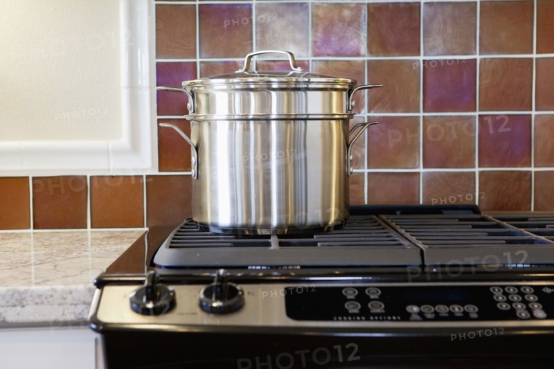 Close-up of utensil on stove in kitchen at home