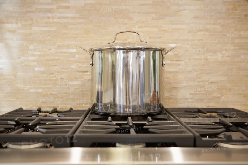 Close-up of a utensil on stove in kitchen at home