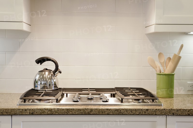 Close-up of a kettle on stove in the kitchen at home