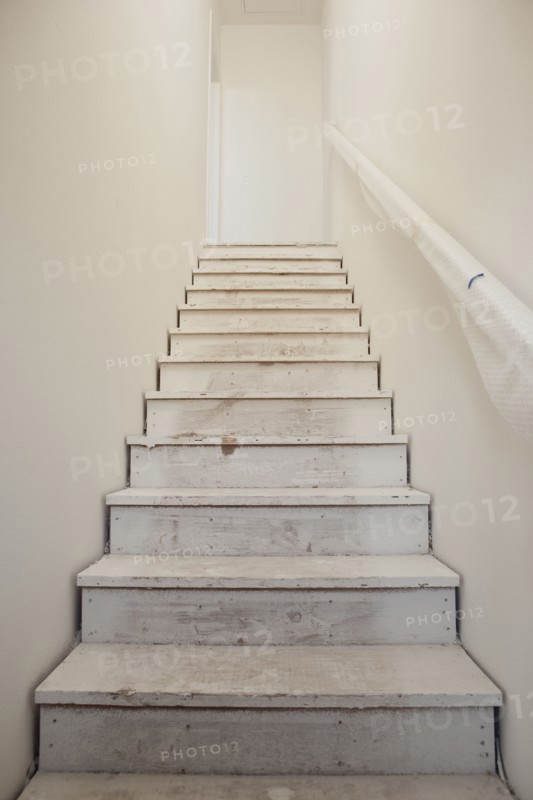 Close-up of white stairs with wall at home