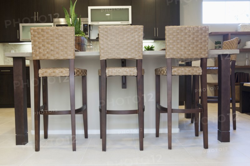 High stools at the kitchen island at home